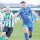 Blyth Town’s Ben Fell, in blue, son of manager Gavin, challenges Blyth Spartans’ Jack Foalle in the historic derby